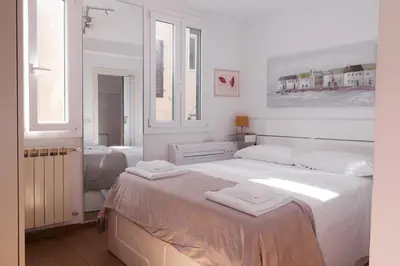 Letto o letti in una camera di Ognissanti Dream Suites