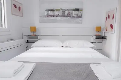 Letto o letti in una camera di Ognissanti Dream Suites