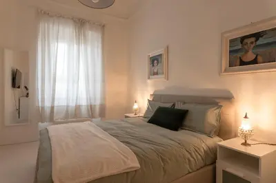 Letto o letti in una camera di Gallery Art Apartment in San Frediano