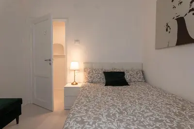Letto o letti in una camera di Gallery Art Apartment in San Frediano