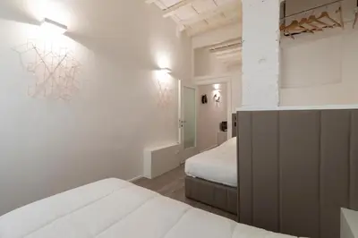 Letto o letti in una camera di Cestello Suite by Mmega