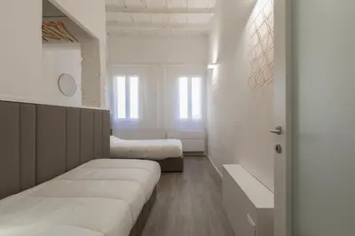 Letto o letti in una camera di Cestello Suite by Mmega
