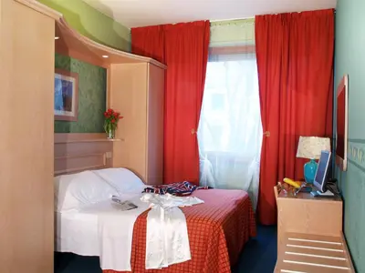 Letto o letti in una camera di Hotel Meridiana