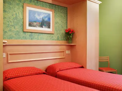 Letto o letti in una camera di Hotel Meridiana