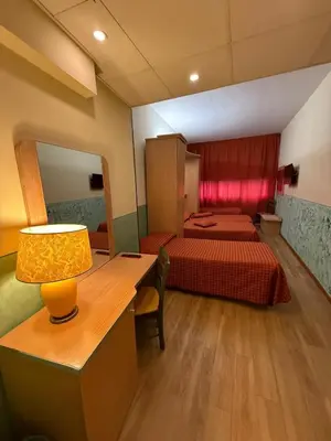 Letto o letti in una camera di Hotel Meridiana