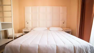 Letto o letti in una camera di Hotel Jane