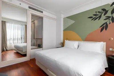 Letto o letti in una camera di DoubleTree by Hilton Florence Metropole