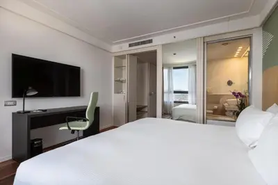 Letto o letti in una camera di DoubleTree by Hilton Florence Metropole