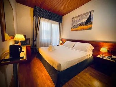 Letto o letti in una camera di Hotel Hermitage