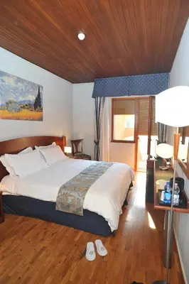 Letto o letti in una camera di Hotel Hermitage