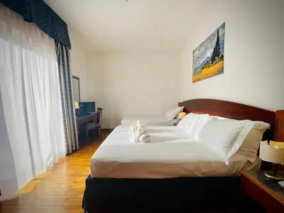 Letto o letti in una camera di Hotel Hermitage
