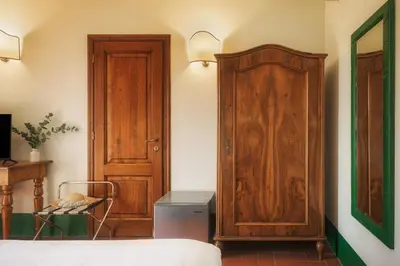 Letto o letti in una camera di Relais Poggio Borgoni