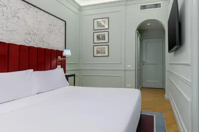 Letto o letti in una camera di Room Mate Collection Isabella, Florence