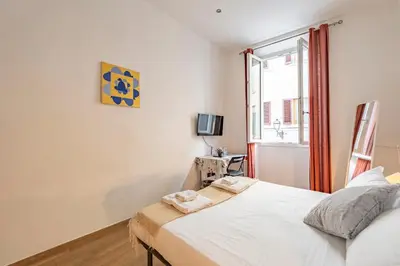 Letto o letti in una camera di San Zanobi Suites- by MOIS Collection