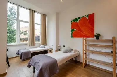 Letto o letti in una camera di San Zanobi Suites- by MOIS Collection