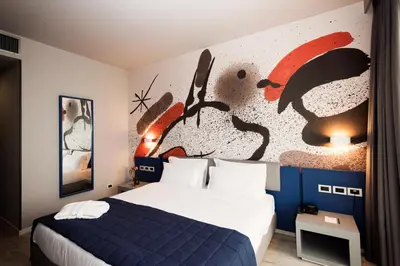 Letto o letti in una camera di JR Hotels Gigli Firenze