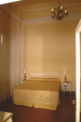 Letto o letti in una camera di Residence Michelangiolo