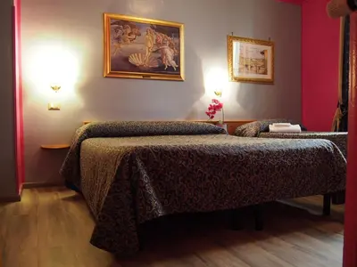 Letto o letti in una camera di Hotel Santa Croce
