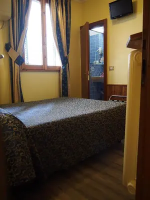 Letto o letti in una camera di Hotel Santa Croce