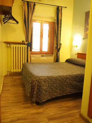 Letto o letti in una camera di Hotel Santa Croce