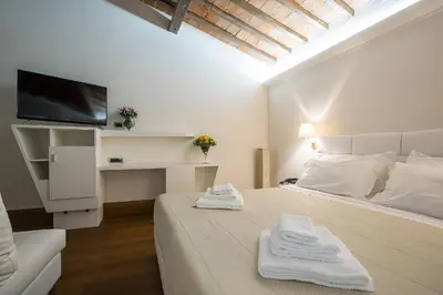 Letto o letti in una camera di Relais Hotel Centrale 