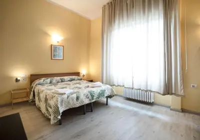 Letto o letti in una camera di Argentiere Room Apartments