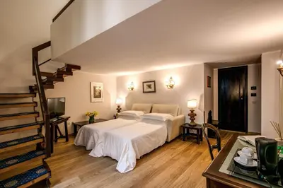 Letto o letti in una camera di Hotel Croce Di Malta
