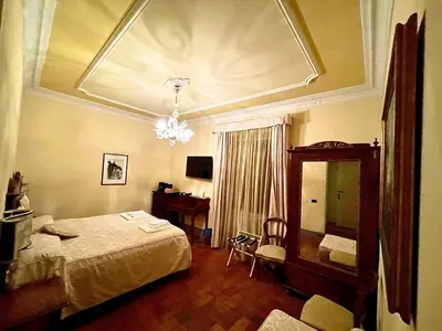 Letto o letti in una camera di Casa Leopardi
