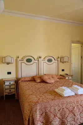 Letto o letti in una camera di Casa Leopardi