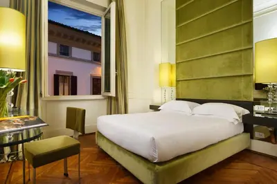 Letto o letti in una camera di Brunelleschi Hotel