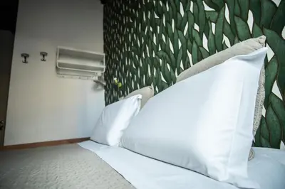 Letto o letti in una camera di Hotel Nella