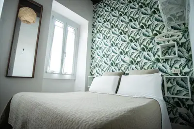 Letto o letti in una camera di Hotel Nella