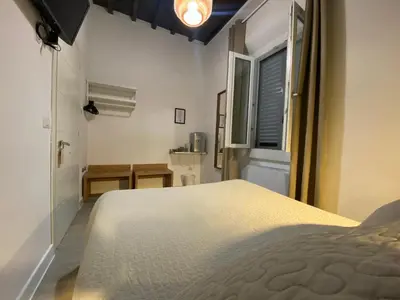 Letto o letti in una camera di Hotel Nella