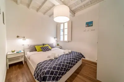 Letto o letti in una camera di 32 nero - Florence Apartment San Niccolò