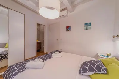 Letto o letti in una camera di 32 nero - Florence Apartment San Niccolò