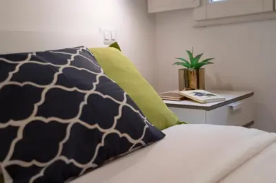 Letto o letti in una camera di 32 nero - Florence Apartment San Niccolò