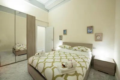 Letto o letti in una camera di Cavour Rosa Apartment by Mamo Florence