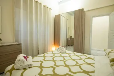 Letto o letti in una camera di Cavour Rosa Apartment by Mamo Florence