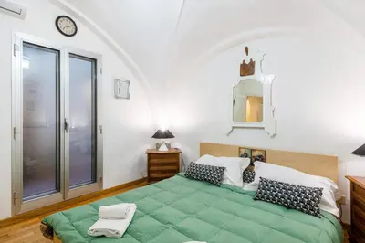 Letto o letti in una camera di GuestHost - Cattedrale di Firenze Apartment