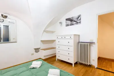 Letto o letti in una camera di GuestHost - Cattedrale di Firenze Apartment