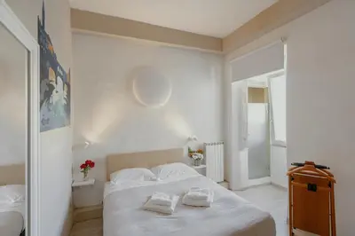 Letto o letti in una camera di 23 Duomo - Camera con vasca idromassaggio