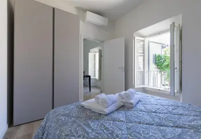Letto o letti in una camera di Otello Suite - Brand new flat Santa Maria Novella