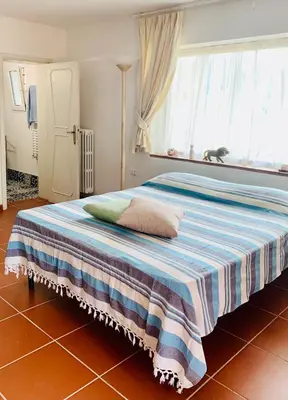 Letto o letti in una camera di La stanza col giardino