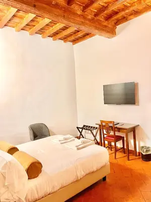Letto o letti in una camera di Soggiorno La Pergola