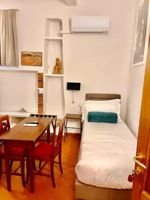 Letto o letti in una camera di Soggiorno La Pergola