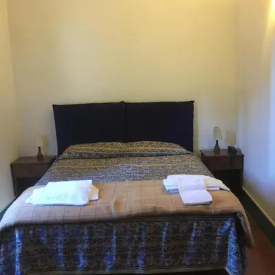 Letto o letti in una camera di Villa Morghen