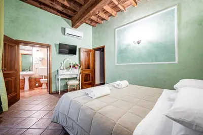 Letto o letti in una camera di Katti House - Florence's center