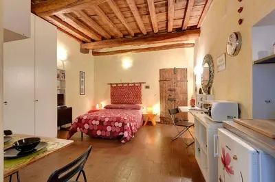 Letto o letti in una camera di Appartamenti Ponte Vecchio