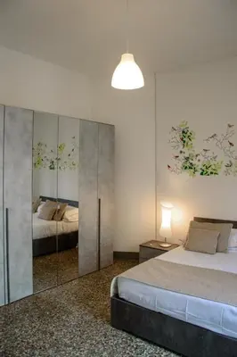 Letto o letti in una camera di Homelink Firenze - Charlotte