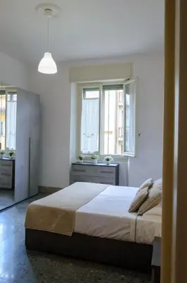 Letto o letti in una camera di Homelink Firenze - Charlotte